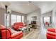 Comfortable living room with modern seating, lots of natural light, and an open floor plan at 1320 Rainbow Meadows Dr, Las Vegas, NV 89128