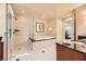Modern bathroom with a walk-in shower, luxurious bathtub, and stylish vanity area at 145 E Harmon Ave # 1001, Las Vegas, NV 89109