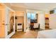Bright bedroom with a wardrobe and a desk with a view of the city skyline at 145 E Harmon Ave # 1001, Las Vegas, NV 89109