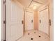 Hallway decorated with doors and tiled floors and intricate ceiling at 145 E Harmon Ave # 1001, Las Vegas, NV 89109
