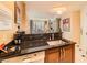 Compact kitchenette featuring sleek countertops and essential appliances at 145 E Harmon Ave # 1001, Las Vegas, NV 89109