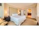 Serene main bedroom with a plush bed and an ensuite bathroom entrance at 145 E Harmon Ave # 1001, Las Vegas, NV 89109
