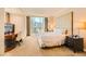Bright main bedroom with a comfortable bed, desk, and city views at 145 E Harmon Ave # 1001, Las Vegas, NV 89109
