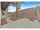Expansive backyard with mature tree and concrete patio, offering a serene outdoor space at 1517 Kirby Dr, Las Vegas, NV 89117