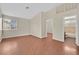 Bright bedroom with wood floors and ensuite bathroom at 1517 Kirby Dr, Las Vegas, NV 89117