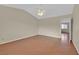 Bright bedroom with hardwood floors and a view of the hallway and doorway enhancing natural light at 1517 Kirby Dr, Las Vegas, NV 89117
