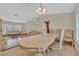 Elegant dining room with ornate furniture, large windows, and tile flooring at 1517 Kirby Dr, Las Vegas, NV 89117