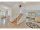 Elegant foyer with a staircase, designer tile floors, and stylish decor, creating a grand entrance at 1517 Kirby Dr, Las Vegas, NV 89117