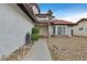 Close-up of the front entrance, with a decorative brick column and landscaped gravel yard at 1517 Kirby Dr, Las Vegas, NV 89117