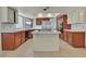 Well-equipped kitchen featuring a center island, stainless steel refrigerator, and ample counter space at 1517 Kirby Dr, Las Vegas, NV 89117