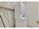 Efficient laundry area equipped with a stacked washer and dryer unit at 1517 Kirby Dr, Las Vegas, NV 89117