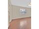 Bright living room with wood floors, a ceiling fan, and natural light streaming through window at 1517 Kirby Dr, Las Vegas, NV 89117