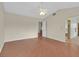 Spacious main bedroom with ceiling fan, complemented by wood floors and ensuite bathroom at 1517 Kirby Dr, Las Vegas, NV 89117