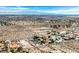 High-angle aerial shot of a desert homesite community set against a backdrop of distant mountains at 156 N Parawan St, Henderson, NV 89015