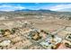 A wide shot of the desert landscape interspersed with homes, showcasing the neighborhood's layout and the vastness of the desert terrain at 156 N Parawan St, Henderson, NV 89015