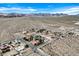 An aerial landscape showing several homes interspersed within the Mojave Desert landscape at 156 N Parawan St, Henderson, NV 89015