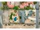 Overhead view of a vast home on a large lot with a swimming pool, a putting green, and mature landscaping at 156 N Parawan St, Henderson, NV 89015