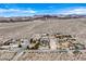 Panoramic landscape showcasing homes nestled amongst the arid Mojave Desert, against the backdrop of distant mountains at 156 N Parawan St, Henderson, NV 89015