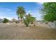 Enjoy the backyard with desert landscaping, outdoor kitchen, and mountain views at 156 N Parawan St, Henderson, NV 89015