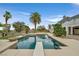 Stunning property with a backyard oasis that includes pool, patio, and a putting green at 156 N Parawan St, Henderson, NV 89015