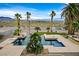 Lush backyard with pool, desert landscaping, and amazing city views at 156 N Parawan St, Henderson, NV 89015