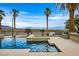 Backyard boasts a modern pool and putting green, set against a panoramic desert vista at 156 N Parawan St, Henderson, NV 89015
