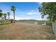 Spacious backyard with rock landscaping and views of the mountains in the distance at 156 N Parawan St, Henderson, NV 89015