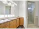 This bathroom features a glass enclosed shower with tiled walls, and vanity with drawers at 156 N Parawan St, Henderson, NV 89015