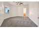 This bedroom features large windows with views and has a door leading to another room at 156 N Parawan St, Henderson, NV 89015