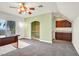 The upstairs bonus room has a balcony with city views, an arched hallway and a wet bar at 156 N Parawan St, Henderson, NV 89015
