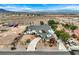 An aerial shot of the home showing the driveway and landscaping in the front of the home with a desert landscape at 156 N Parawan St, Henderson, NV 89015