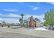 Charming two-story home with palm trees, a brick accent wall, and a spacious driveway at 156 N Parawan St, Henderson, NV 89015