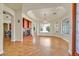 Bright living room featuring hardwood floors, a fireplace, and elegant lighting, perfect for entertaining guests at 156 N Parawan St, Henderson, NV 89015