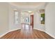 Open-concept living room featuring hardwood floors and arched doorways at 156 N Parawan St, Henderson, NV 89015