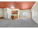 Open concept living room with a kitchenette and windows that provide natural light inside of home at 156 N Parawan St, Henderson, NV 89015