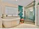 Stylish bathroom with soaking tub, glass shower and custom tile accents at 1970 Del Font Ct, Las Vegas, NV 89117