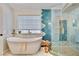 Bright bathroom with soaking tub, glass shower and custom tile accents at 1970 Del Font Ct, Las Vegas, NV 89117