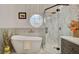 Bright bathroom boasts a tub, glass shower, and elegant vanity with gold fixtures at 1970 Del Font Ct, Las Vegas, NV 89117