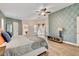 Large bedroom with wood floors, natural light and tastefully decorated walls at 1970 Del Font Ct, Las Vegas, NV 89117