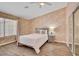 Cozy bedroom with floral wallpaper, hardwood floors, and a sliding door closet at 1970 Del Font Ct, Las Vegas, NV 89117