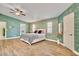 Bright bedroom with wood floors, walk in closet and decorative blue wallpaper at 1970 Del Font Ct, Las Vegas, NV 89117
