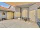 Charming courtyard with lattice windows, ornate doors, and seating area, perfect for outdoor relaxation at 1970 Del Font Ct, Las Vegas, NV 89117