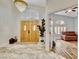 Grand foyer with double doors, chandelier, and marble flooring, leading to a living area at 1970 Del Font Ct, Las Vegas, NV 89117