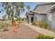Inviting front yard with desert landscaping, decorative rocks, walkway, and gray stucco exterior at 1970 Del Font Ct, Las Vegas, NV 89117