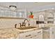 Elegant kitchen features granite counters, tiled backsplash, bronze fixtures and stainless steel appliances at 1970 Del Font Ct, Las Vegas, NV 89117