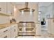 Close up of chef's kitchen featuring stainless steel appliances, custom cabinets, and granite counters at 1970 Del Font Ct, Las Vegas, NV 89117
