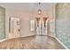 Large living room with hard wood floors and doors leading to patio at 1970 Del Font Ct, Las Vegas, NV 89117