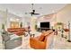 Spacious living room featuring marble floors, a ceiling fan, and comfortable leather furniture at 1970 Del Font Ct, Las Vegas, NV 89117