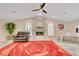Open living room with decorative fireplace, plush seating and piano at 1970 Del Font Ct, Las Vegas, NV 89117