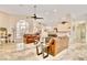 Open living room boasts marble floors, large windows, and seamlessly connects to the kitchen at 1970 Del Font Ct, Las Vegas, NV 89117